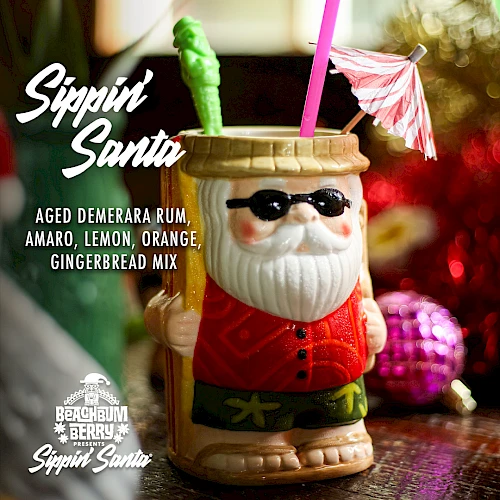 A cocktail menu featuring "Sippin’ Santa" with aged Demerara rum, amaro, lemon, orange, and gingerbread mix in a Santa-themed mug.