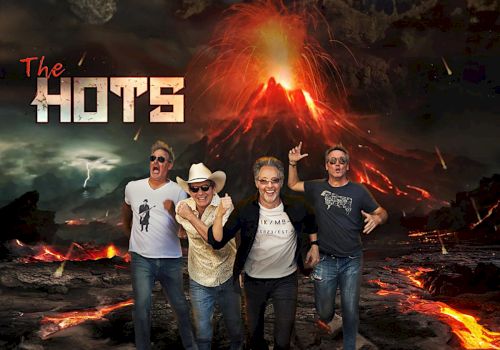 Four people stand in front of a volcanic eruption. The text "The Hots" appears on the left. The background features an erupting volcano and lava.