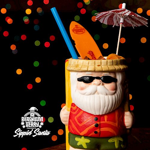 A festive Santa-themed cocktail with colorful straws and an umbrella. Text reads "Sippin' Santa" and lists ingredients like rum and citrus mix.